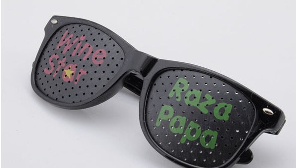 Sunglasses with logo printed on lenses and red frame